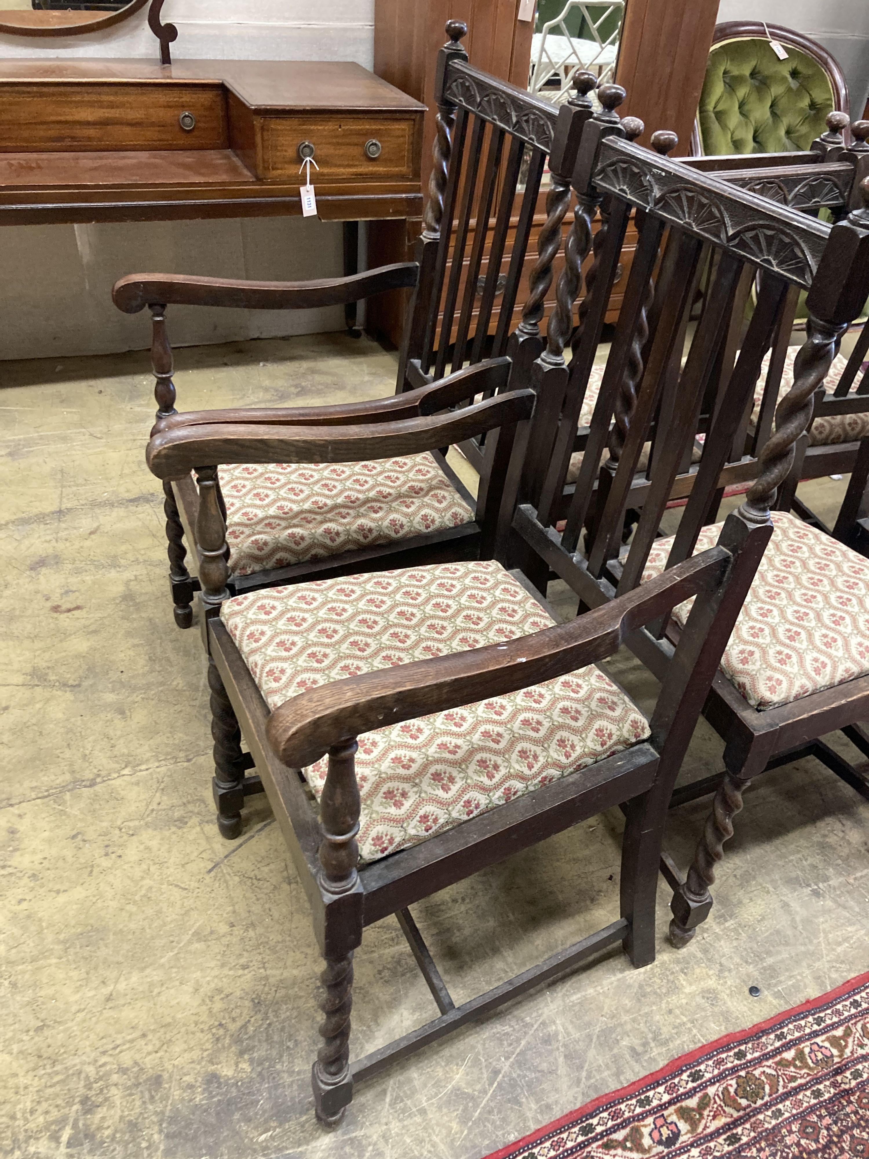 A set of six 1920's oak barleytwist dining chairs, two with arms
